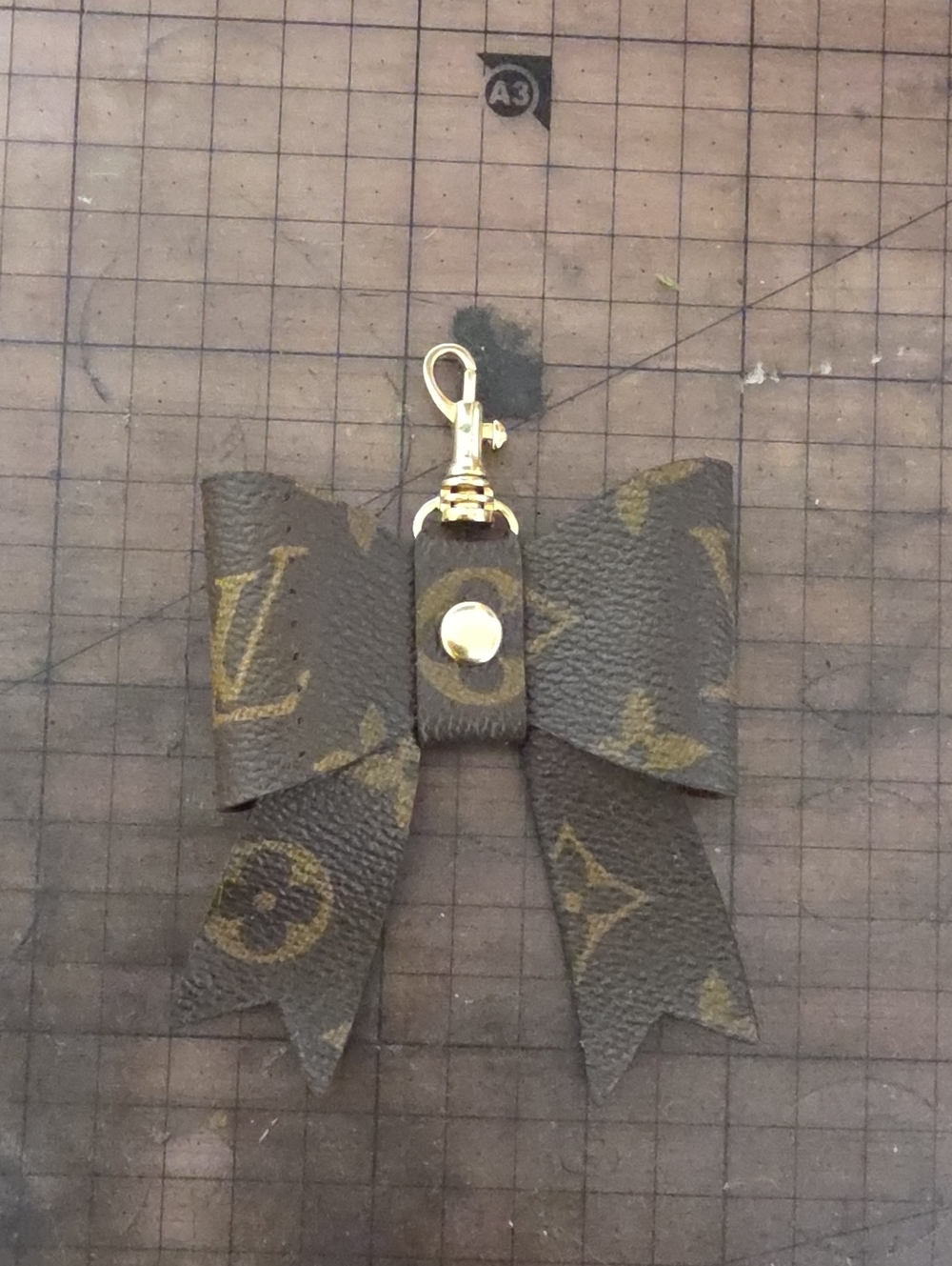 Brown Monogram Bow Bagcharm with Gold Clip